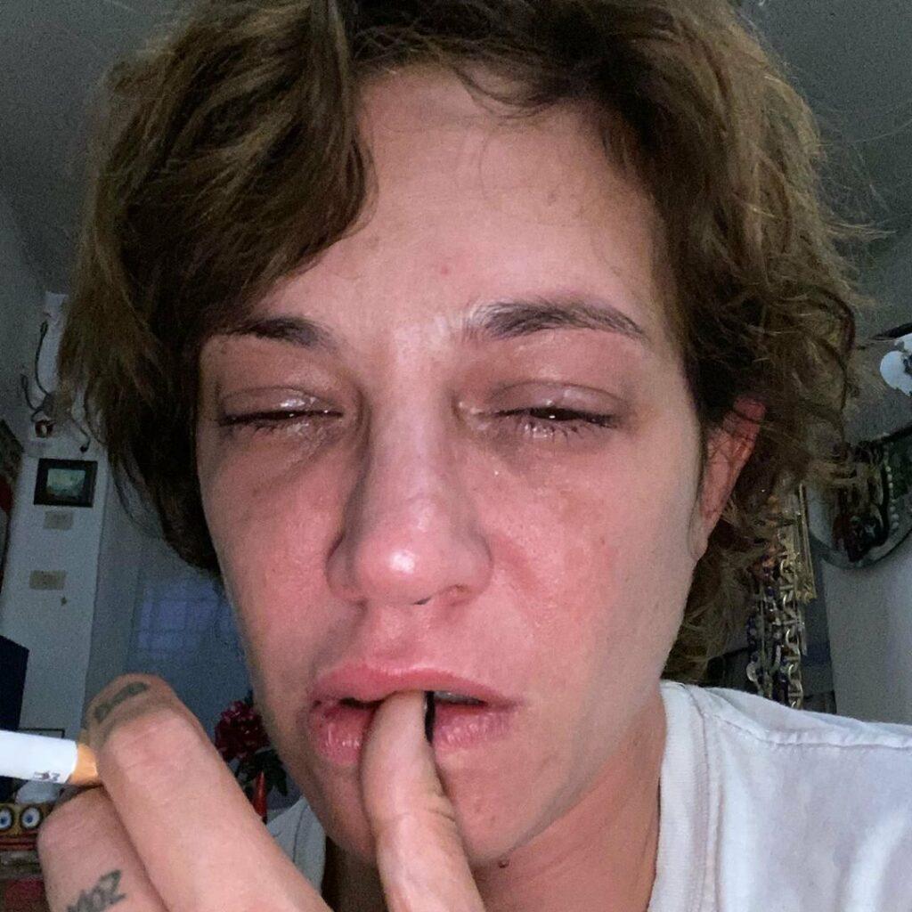 Asia Argento crying on the anniversary of Bourdain's death.