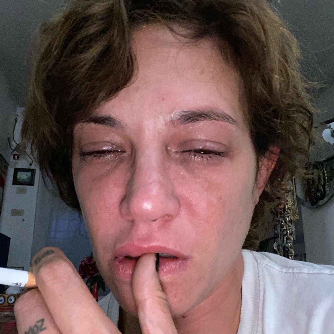 Asia Argento crying on the anniversary of Bourdain's death.