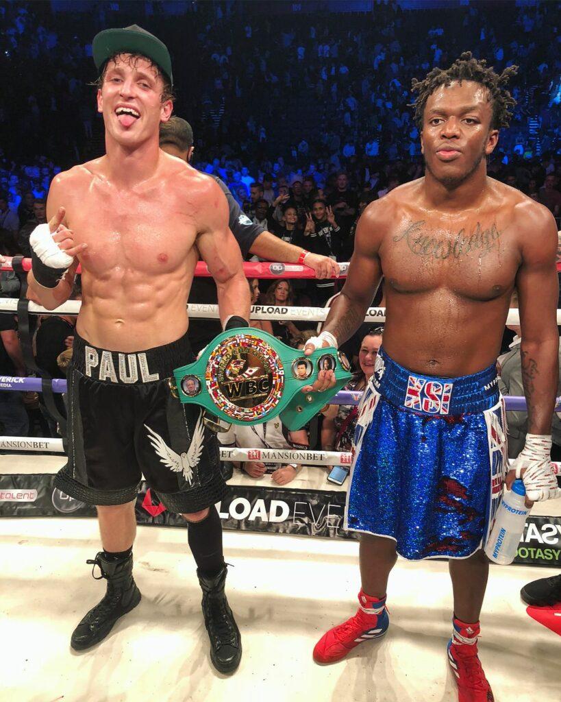 Logan Paul & KSI hold boxing match belt 