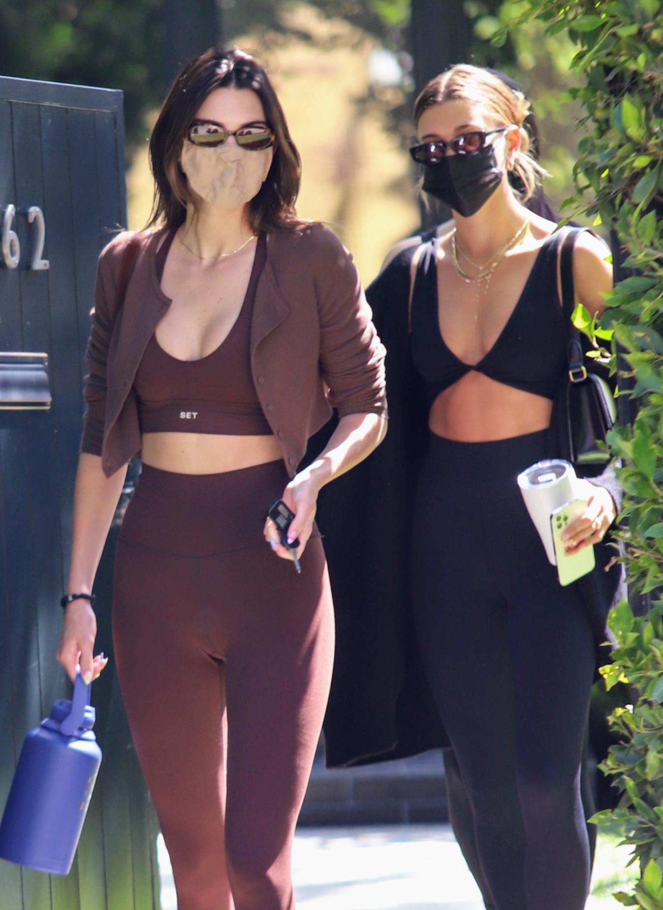 Kendall Jenner flashes her toned tummy in a crop top and leggings after  claims she has reunited with ex Devin Booker