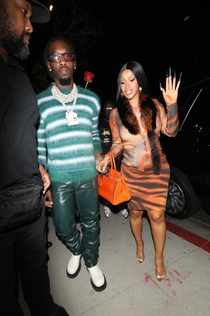 A pregnant Cardi B wears a leopard print dress as she and Offset head to BOA Steakhouse