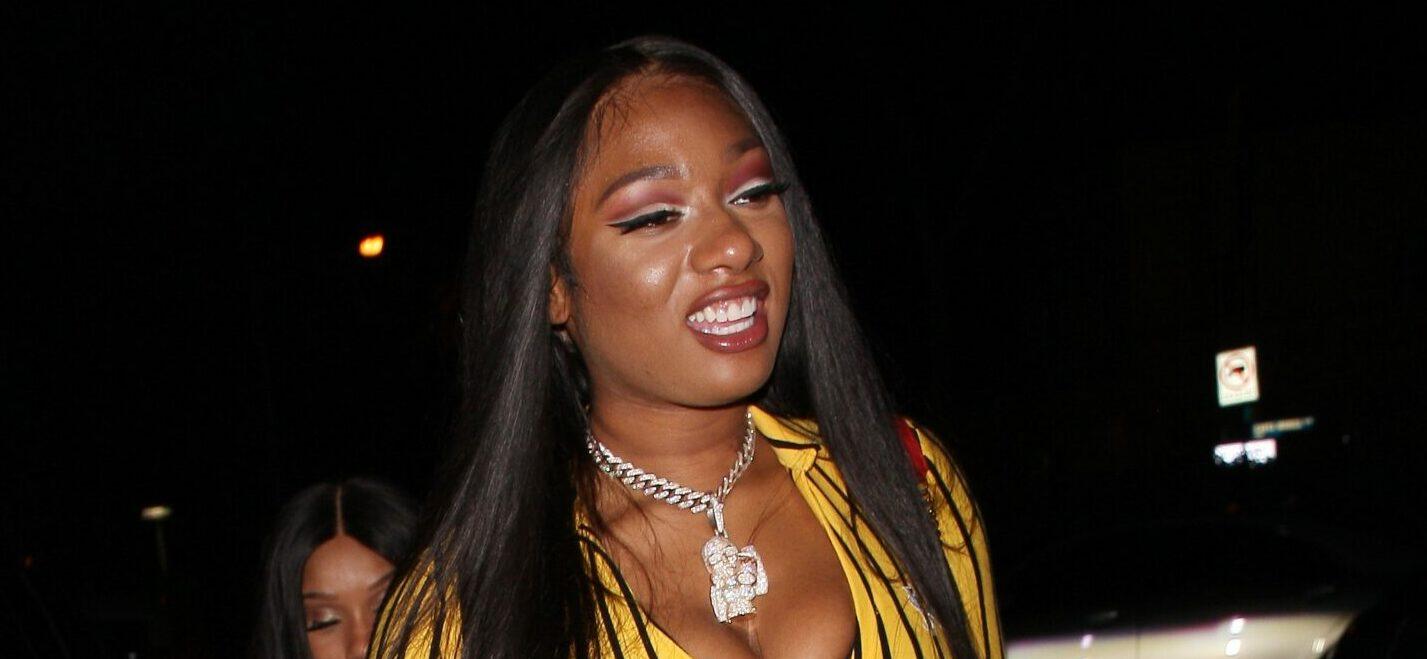 Rapper Megan Thee Stallion wears a striped yellow jumpsuit as she parties at the Delilah restaurant