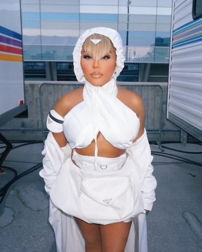 Lil' Kim in a white outfit