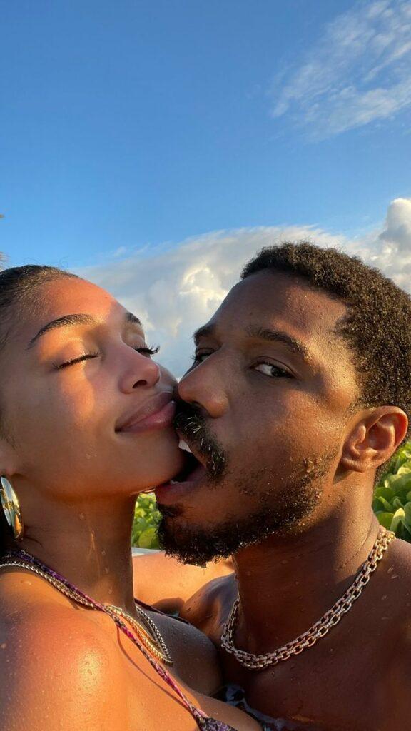 Michael B. Jordan bites Lori Harvey's face.