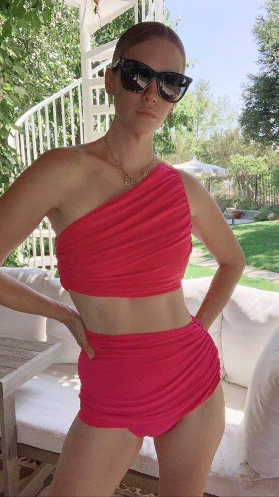 January Jones in a red swimsuit.