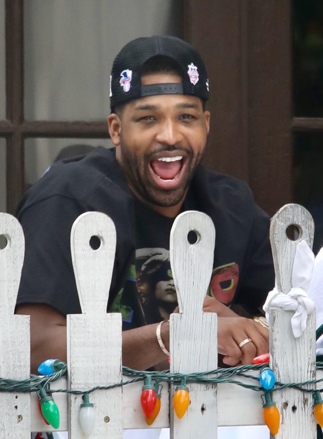 Tristan Thompson seen days after baby True's 1st birthday drinking champagne and eating pizza at The Ivy