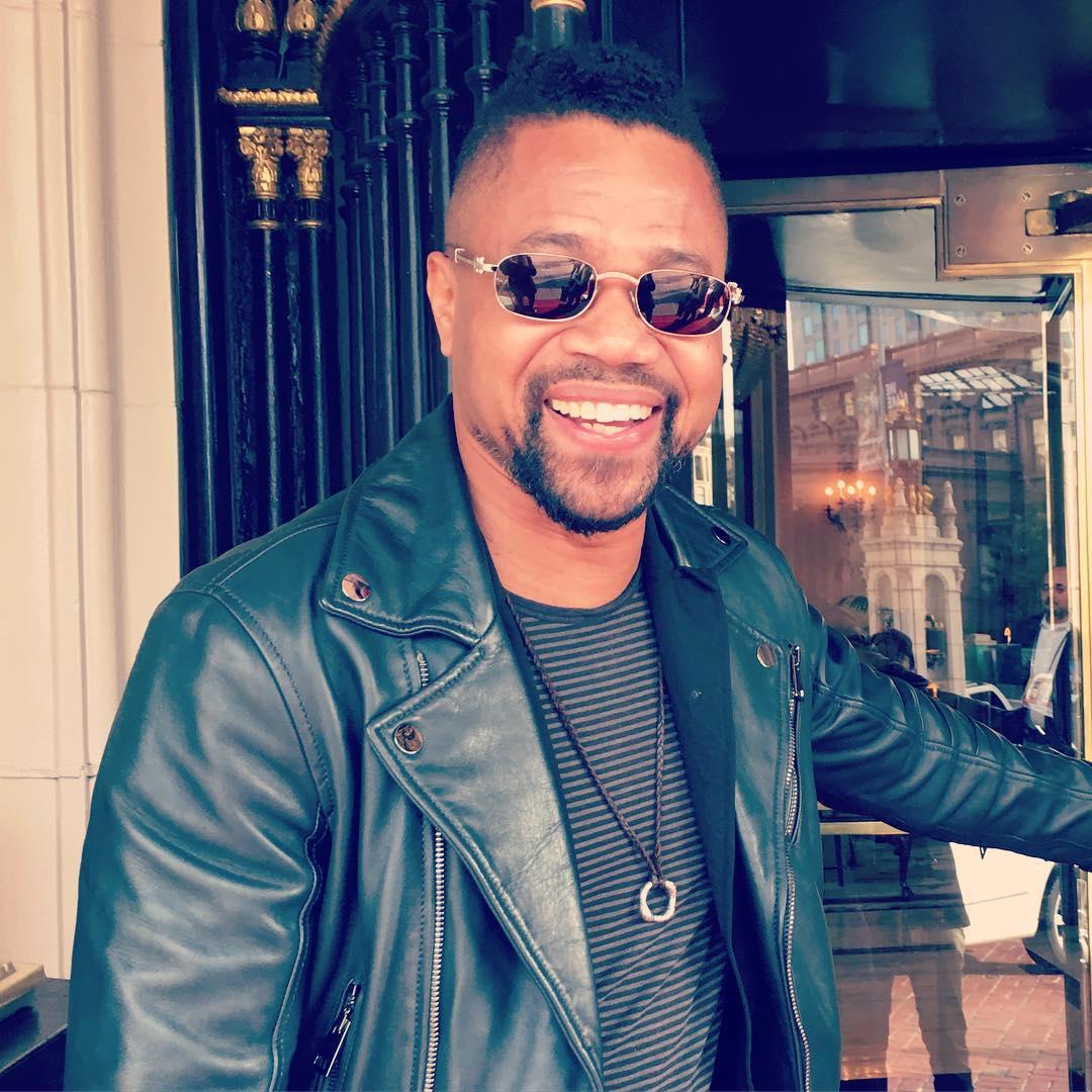 A photo showing Cuba Gooding Jr. sporting a black leather jacket.