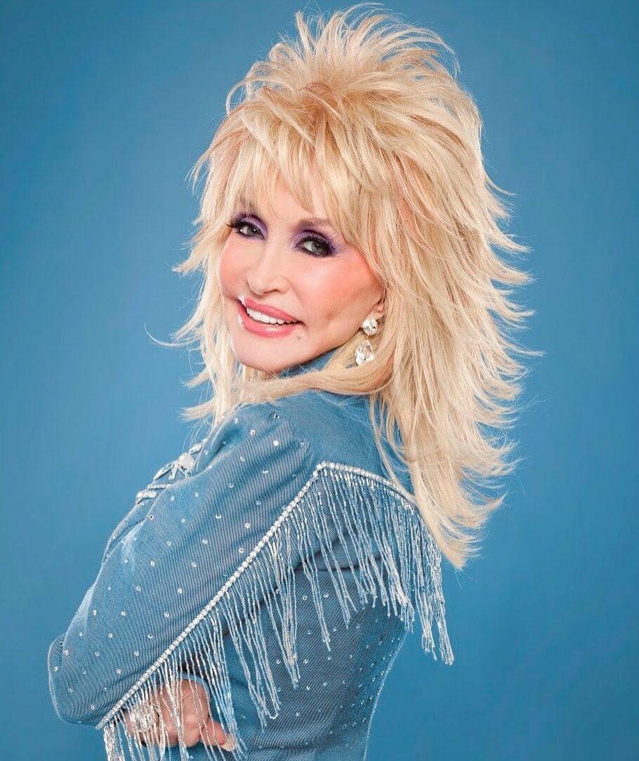 A photo of Dolly Parton in a blue outfit