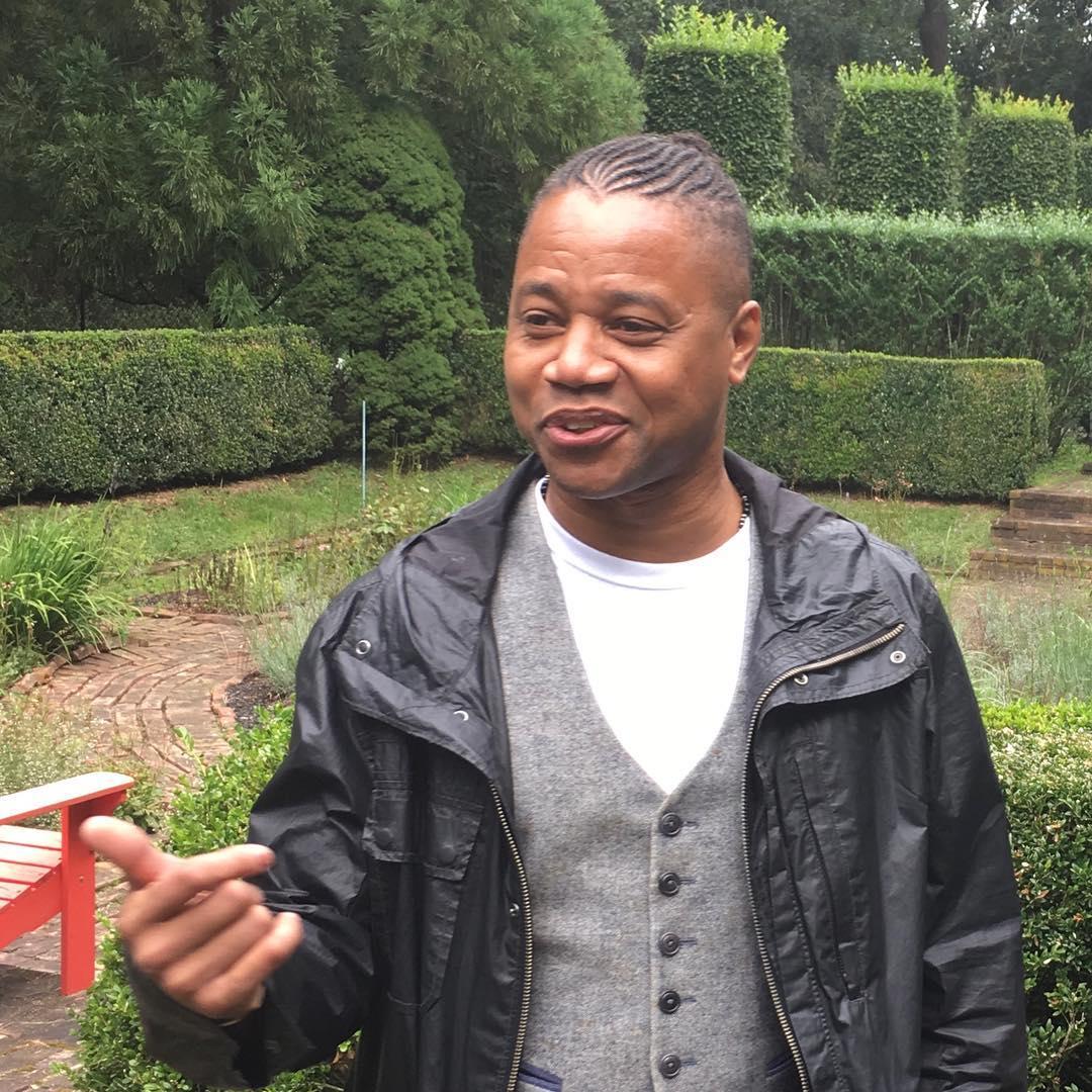 A photo showing Cuba Gooding Jr. in a garden