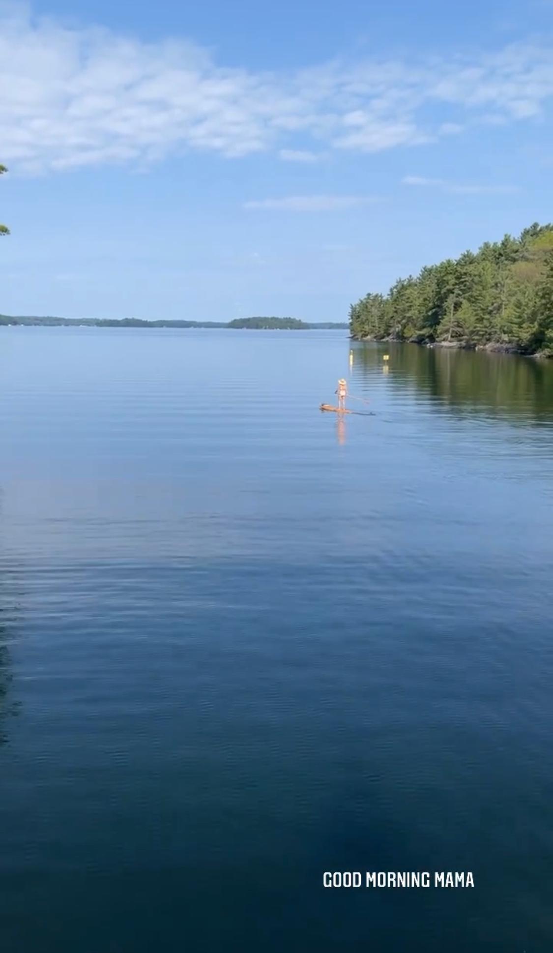 Lisa Rinna paddleboarding in the lake.