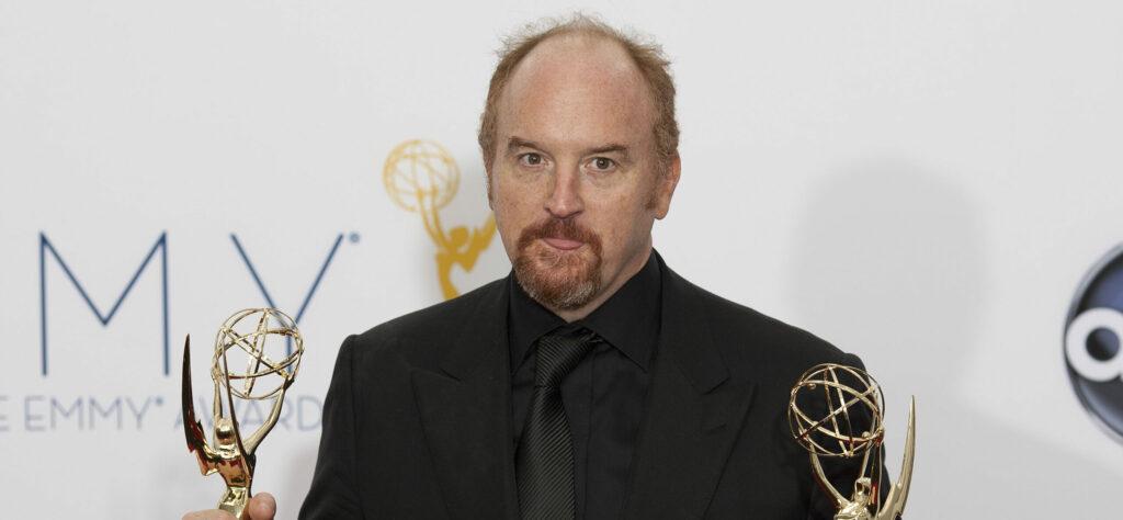Louis C.K. holding two Emmy awards