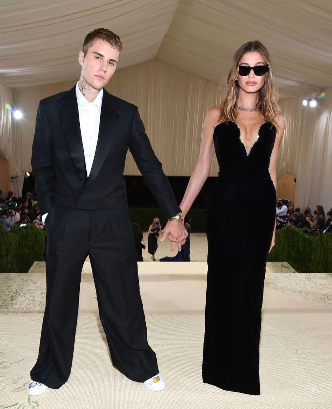 A lovely photo of Justin and Hailey Bieber holding hands, in their Met Gala outfits.