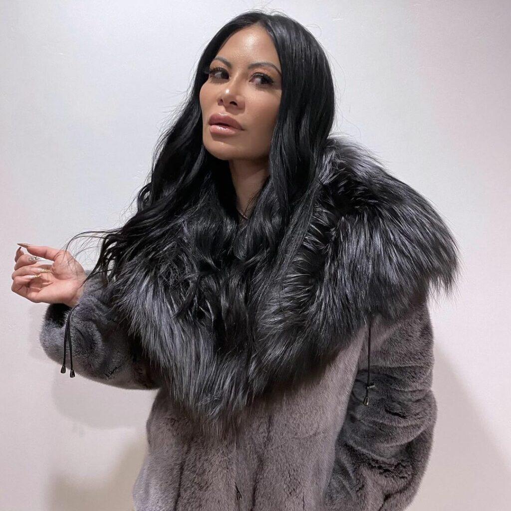 A photo of Jen Shah in a gray fur coat, and she looks gorgeous.