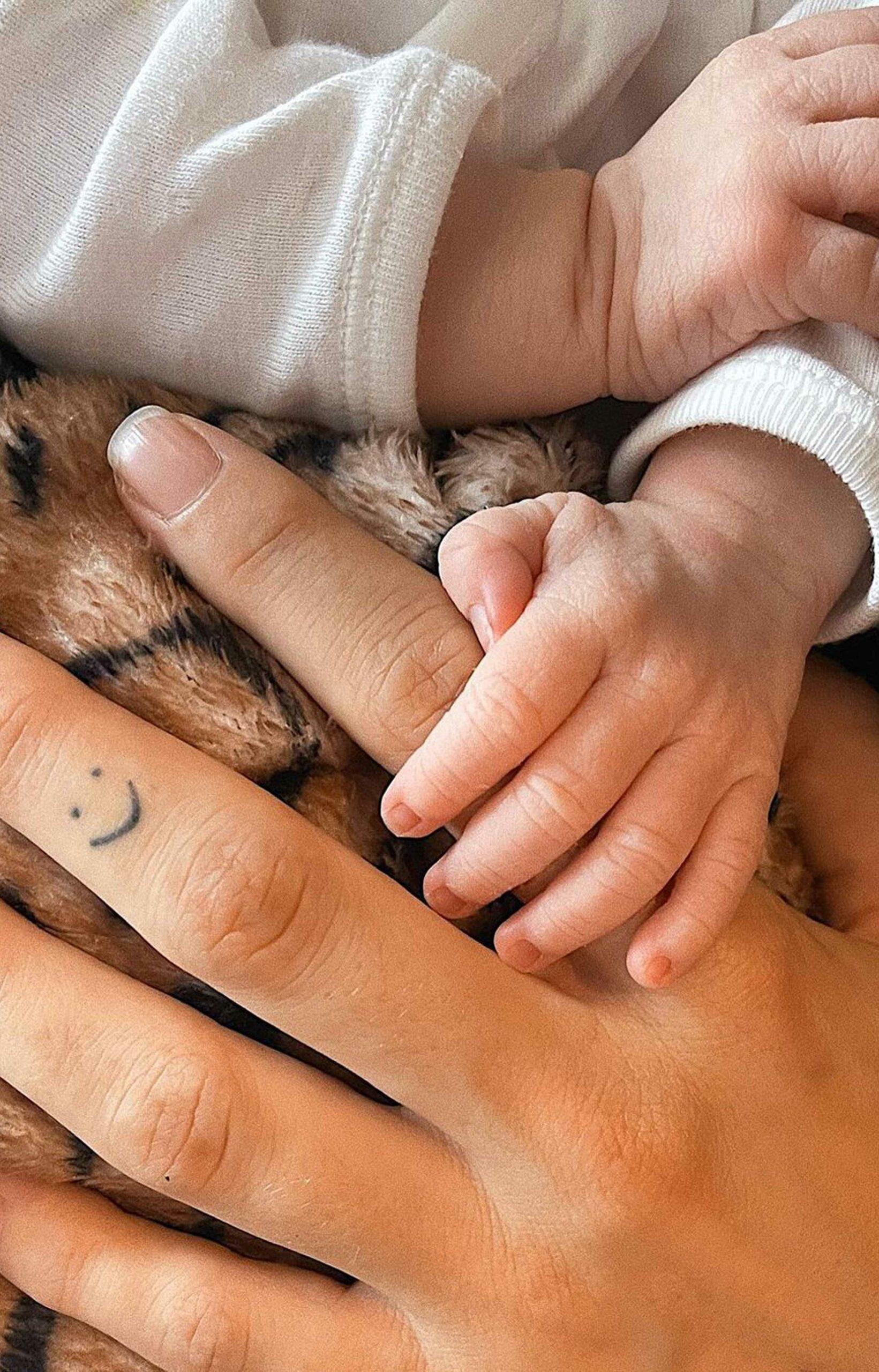 KJ Apa's son's hand