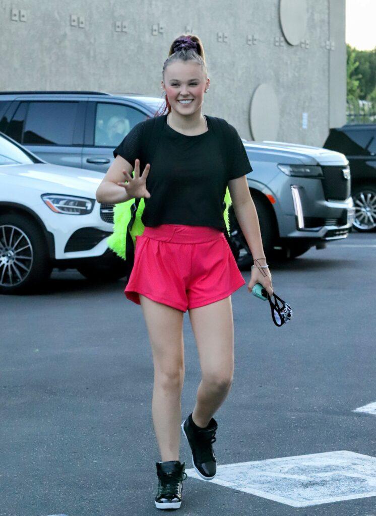 Jojo Siwa arrives with parents toting a giant Balenciaga backpack ahead of DWTS dance rehearsals