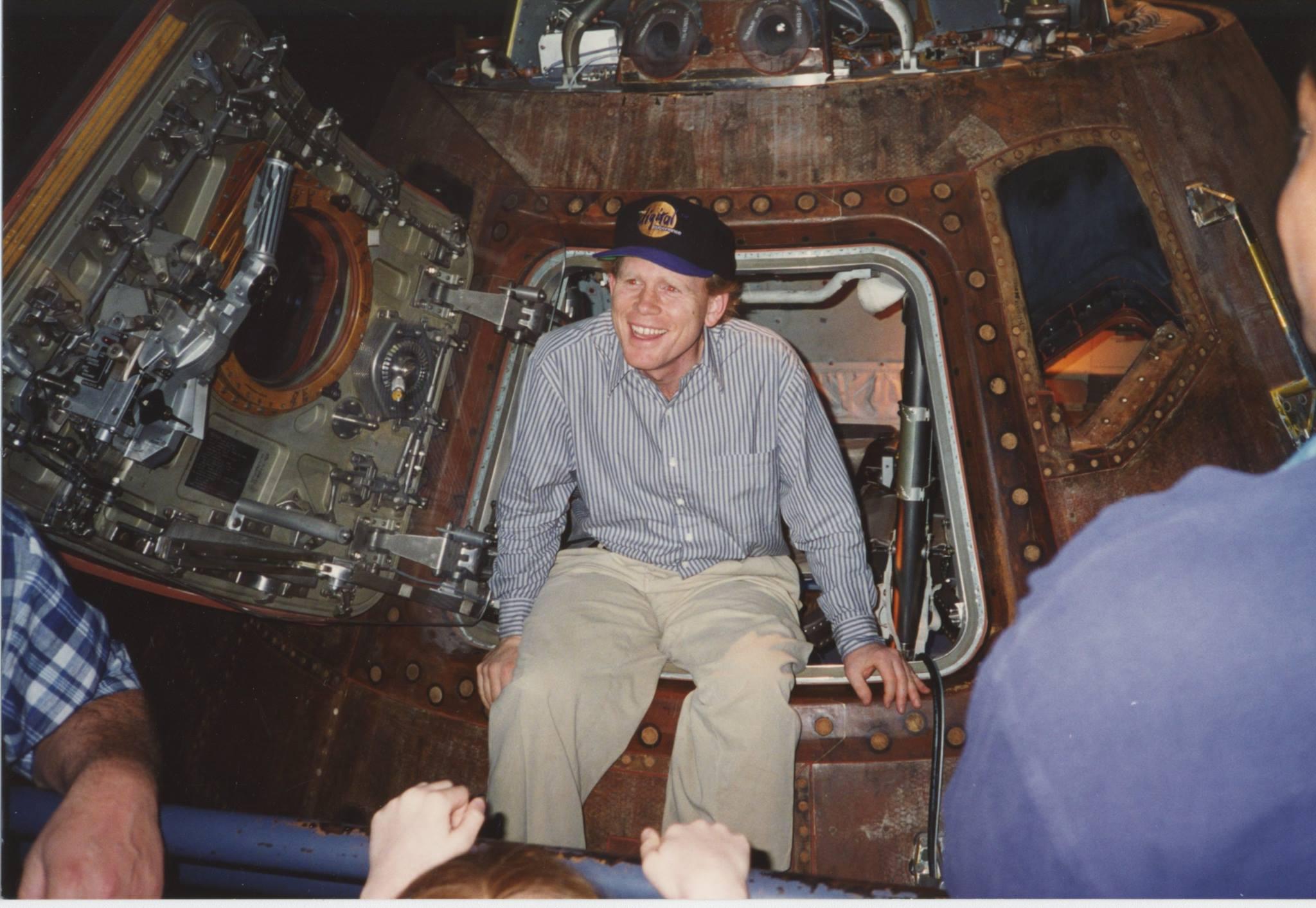 A photo showing Ron Howard and his crew hanging out in a capsule.