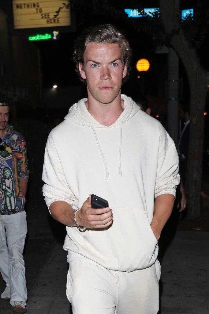Will Poulter in an all-white sweat suit 