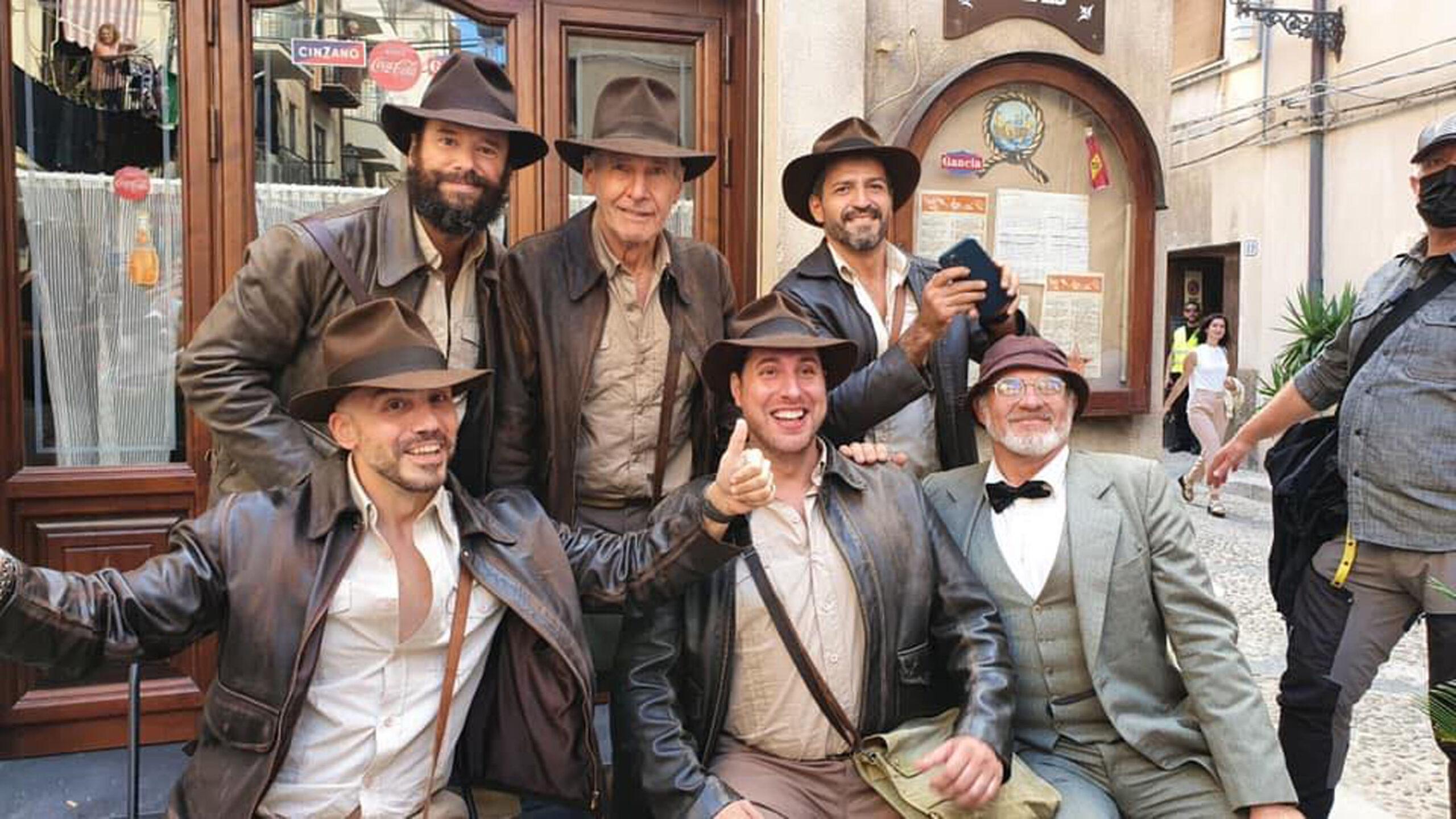 Harrison Ford poses with members Italy’s Indiana Jones Fan Club all dressed in full “Indy” costume while filming "Indiana Jones 5" on location in Italy.