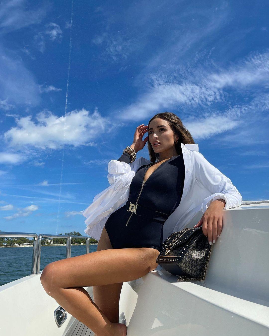 Olivia Culpo Flaunts New ‘Weapon Of Choice’ In Stunning Bond Girl Outfit