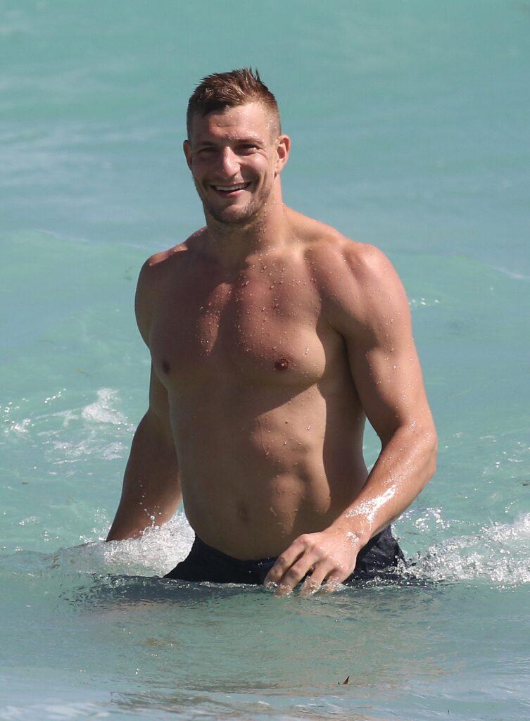 Shirtless Rob Gronkowski takes a dip in the ocean in Miami