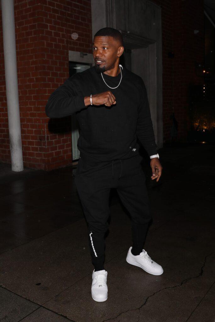 Jamie Foxx takes precaution by saying goodbye with his elbow after having dinner at Mr Chow restaurant
