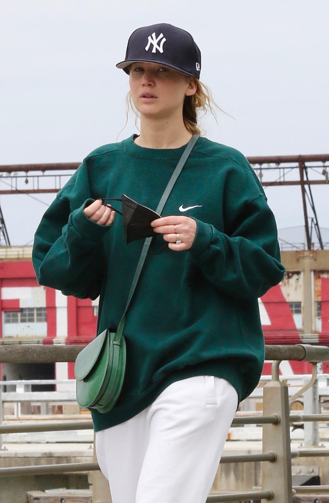 Jennifer Lawrence in sweats goes on a power walk with husband Cooke Maroney in Hudson River Park NYC