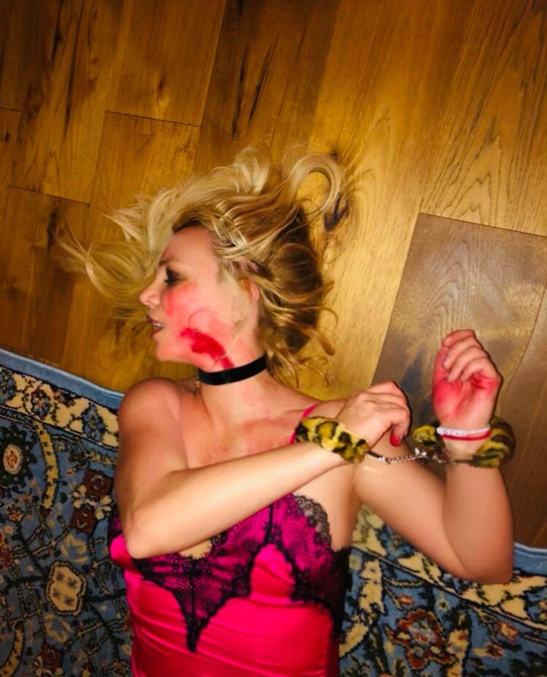 Britney Spears Flaunts Fuzzy Handcuffs In Bizarre Murder Mystery Halloween Costume