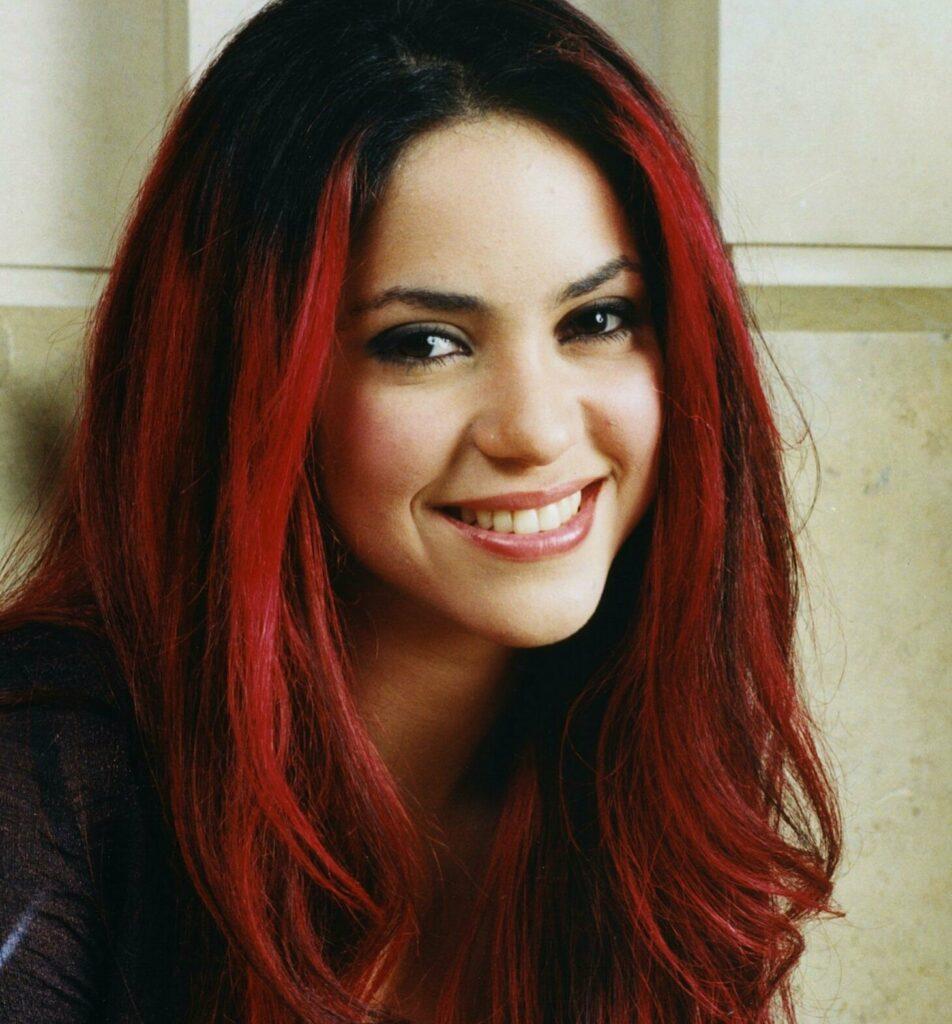 Young shakira, black and red hair
