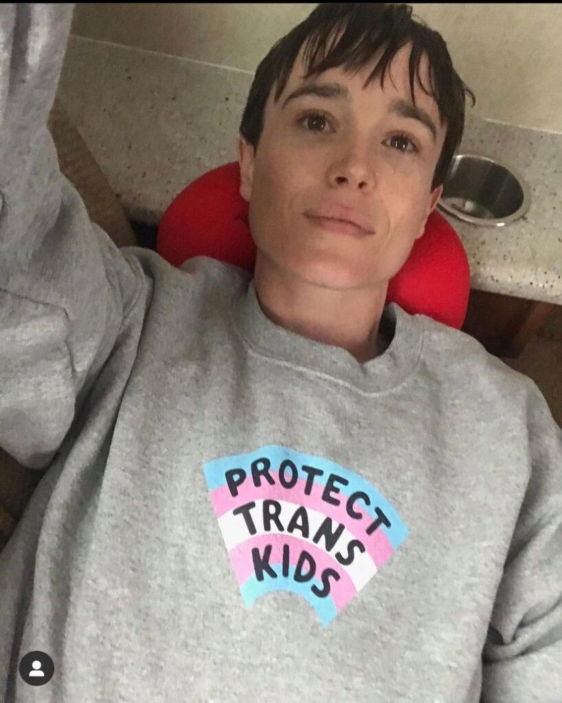 Elliot Page in a Trans sweatershirt
