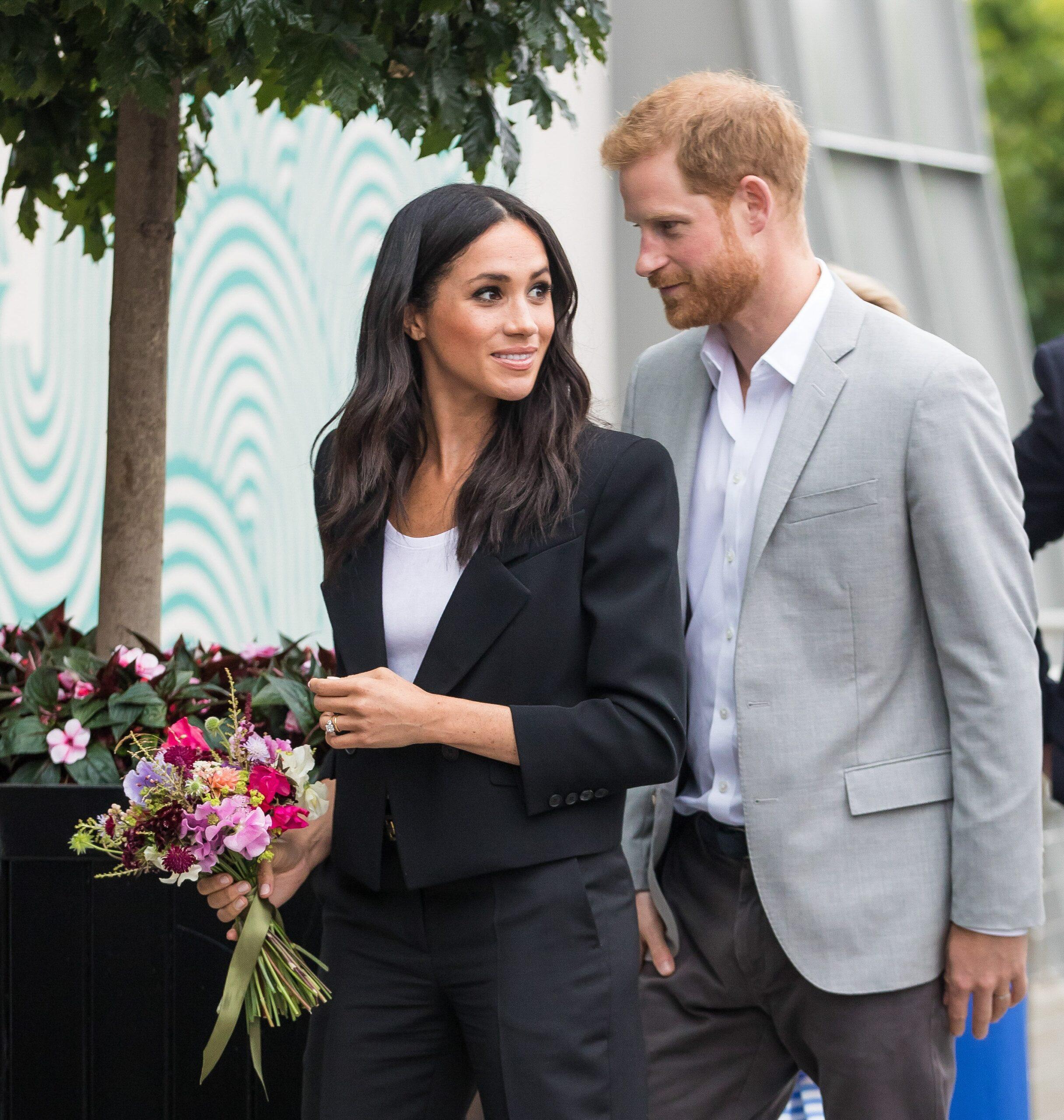 Prince Harry and Meghan Markle smiling