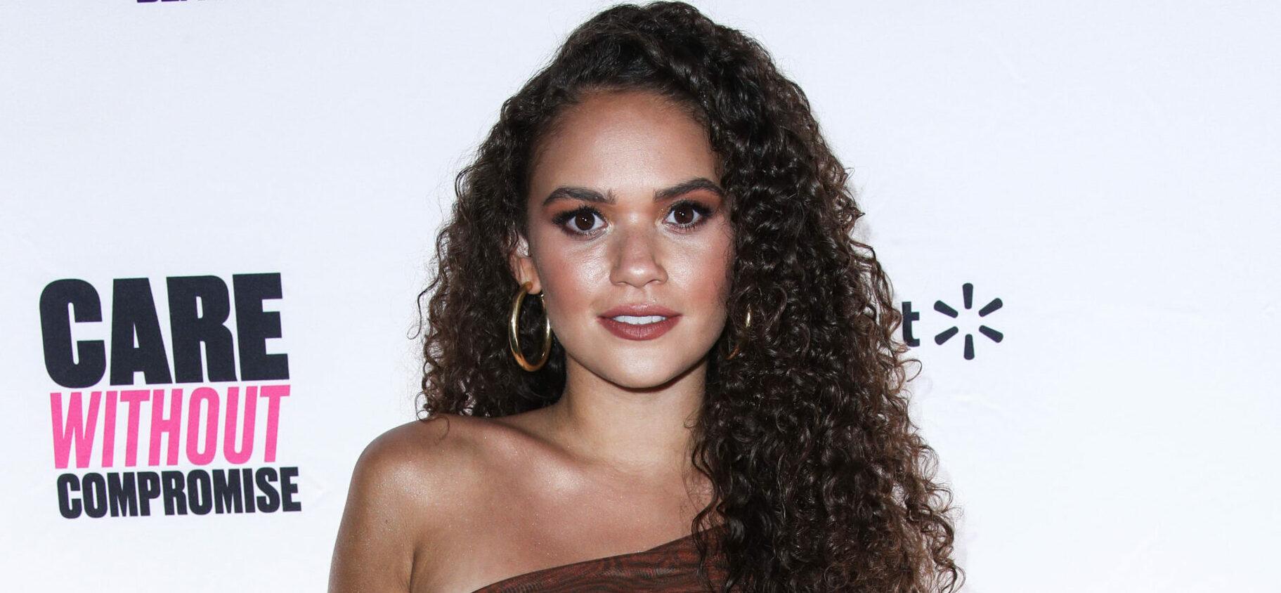 Madison Pettis Reads A Book In See-Through Lace Dress With High Slit