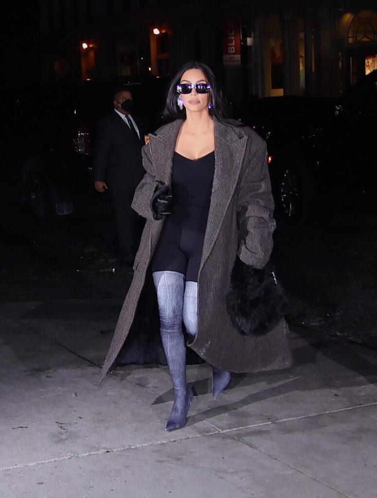 Kim Kardashian wearing sunglasses at night