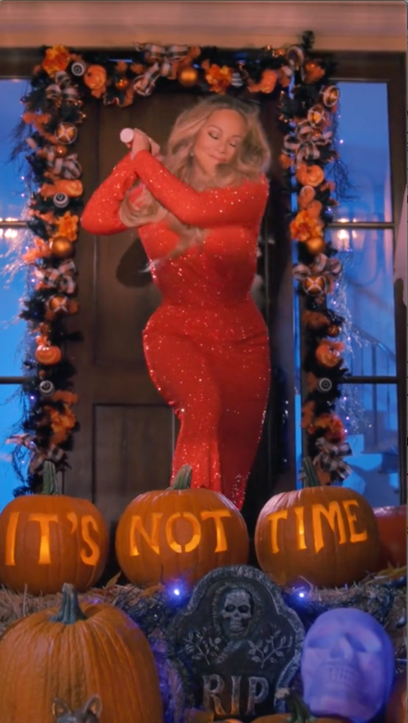 Mariah Carey in a red sparkly gown