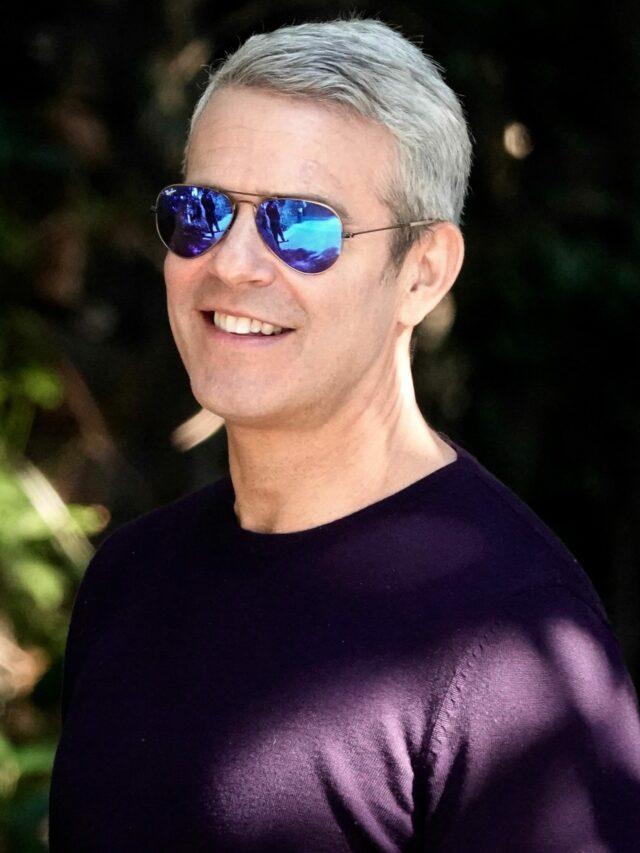 Talk show host Andy Cohen and an unknown male are seen canoodling and laughing as they leave a party in Beverly Hills