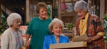 The Golden Girls gathered around a piano