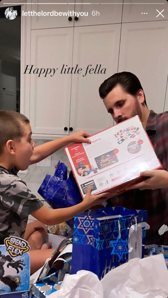 Scott Disick with his son Reign opening gifts.