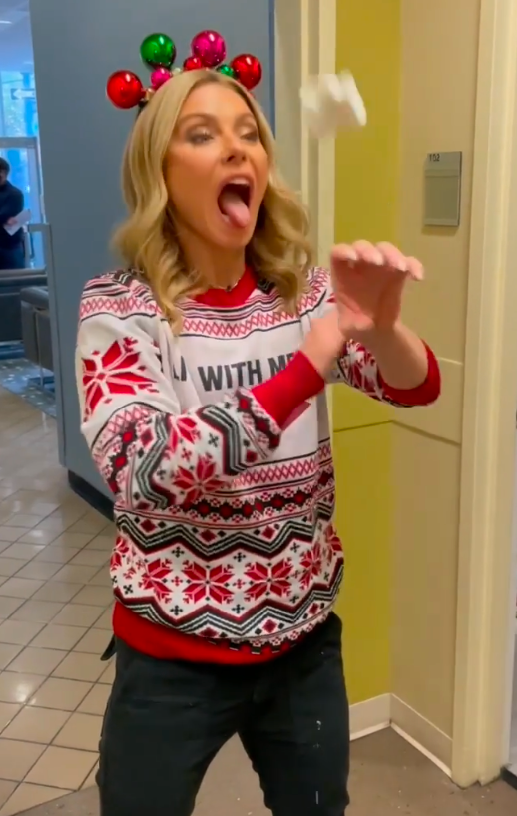 Kelly Ripa Licks Whipped Cream Off Herself During Holiday Party Shenanigans