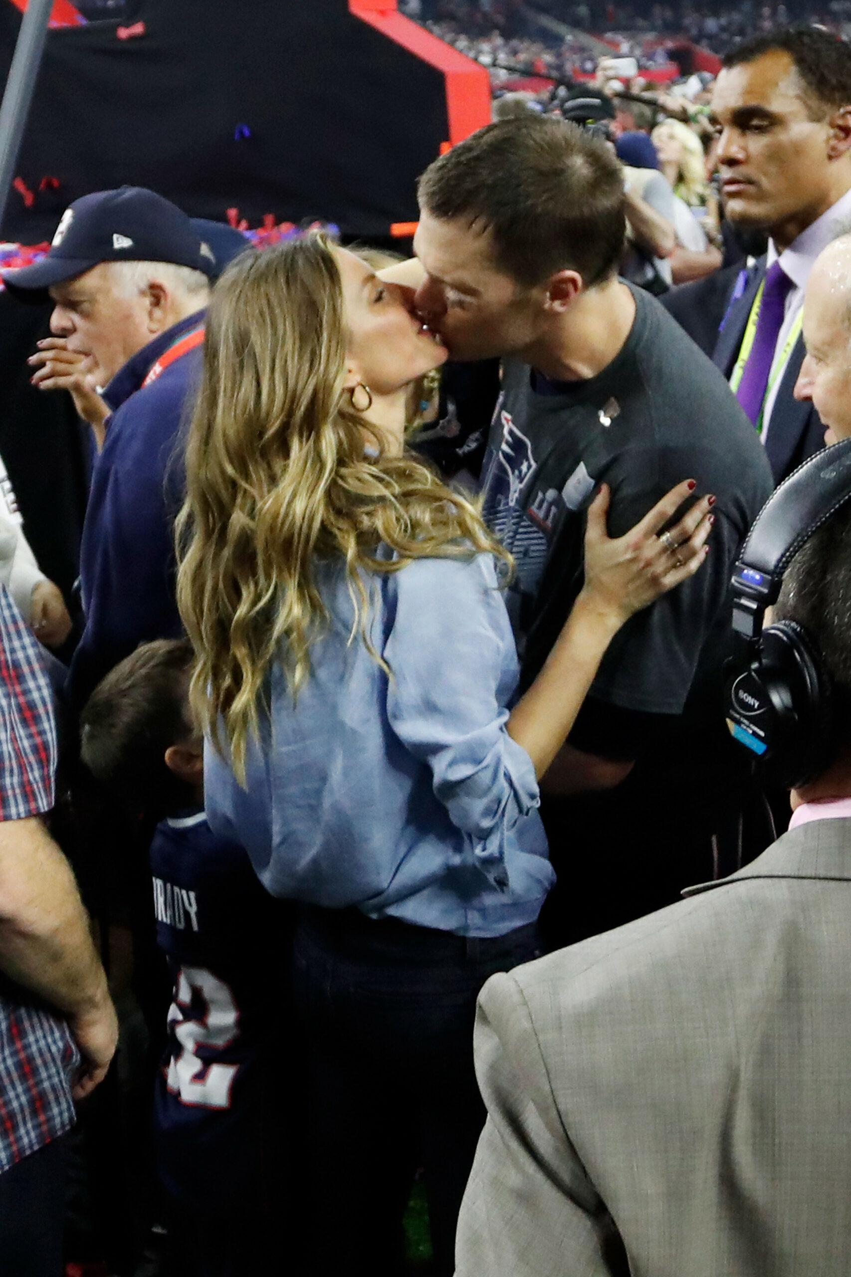 Gisele Bundchen (R) holds her daughter Vivian Lake Brady as she celebrates her husband Tom Brady's win over the Atlanta Falcons in Super Bowl LI