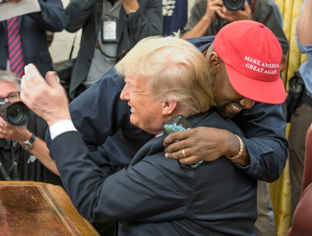 Kanye West hugs United States President Donald J. Trump hugs they meet the Oval Office of the White House in