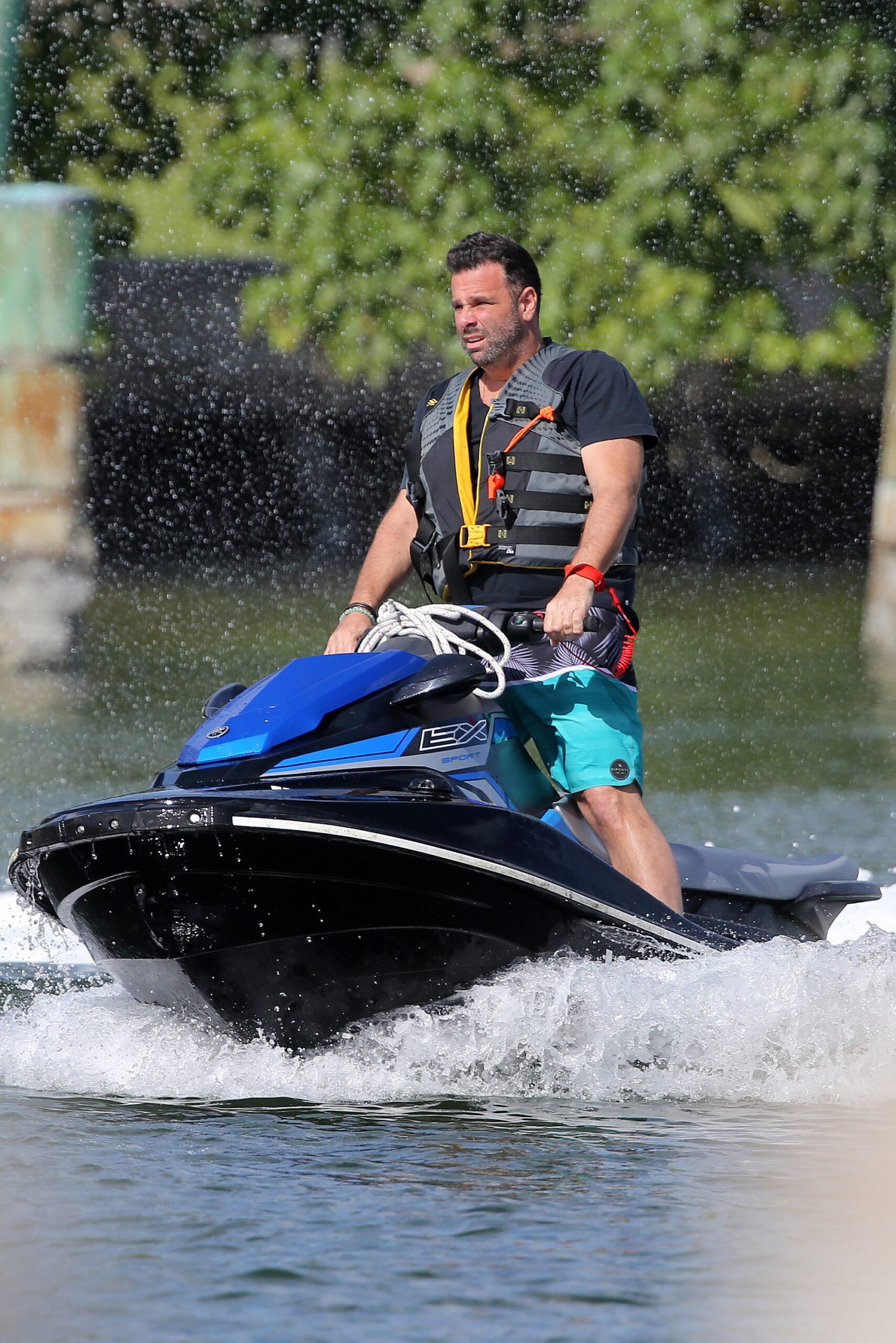 Pregnant Vanderpump Rules star Lala Kent relaxes in her favorite neutral tones as she gives fianc Randall Emmett a quick kiss as he take a break from zooming around on his wave runner