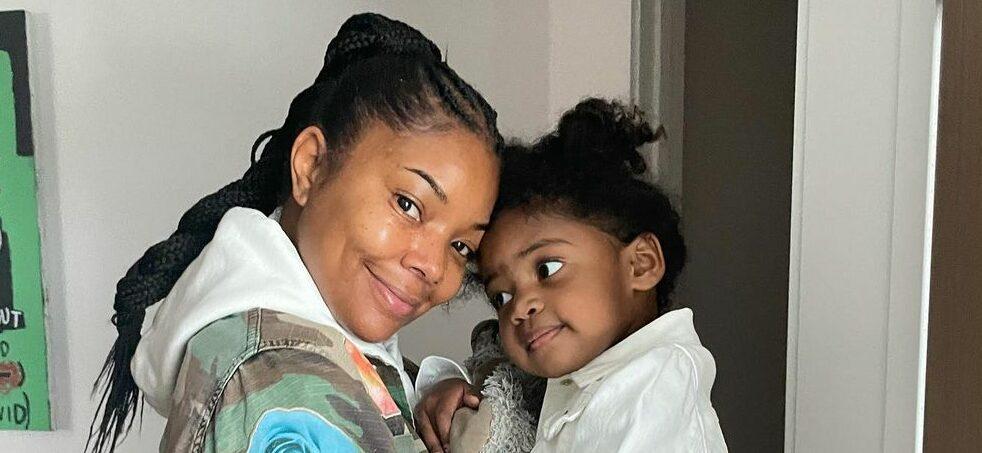 Gabrielle Union & daughter Kaavia James hugging and smiling