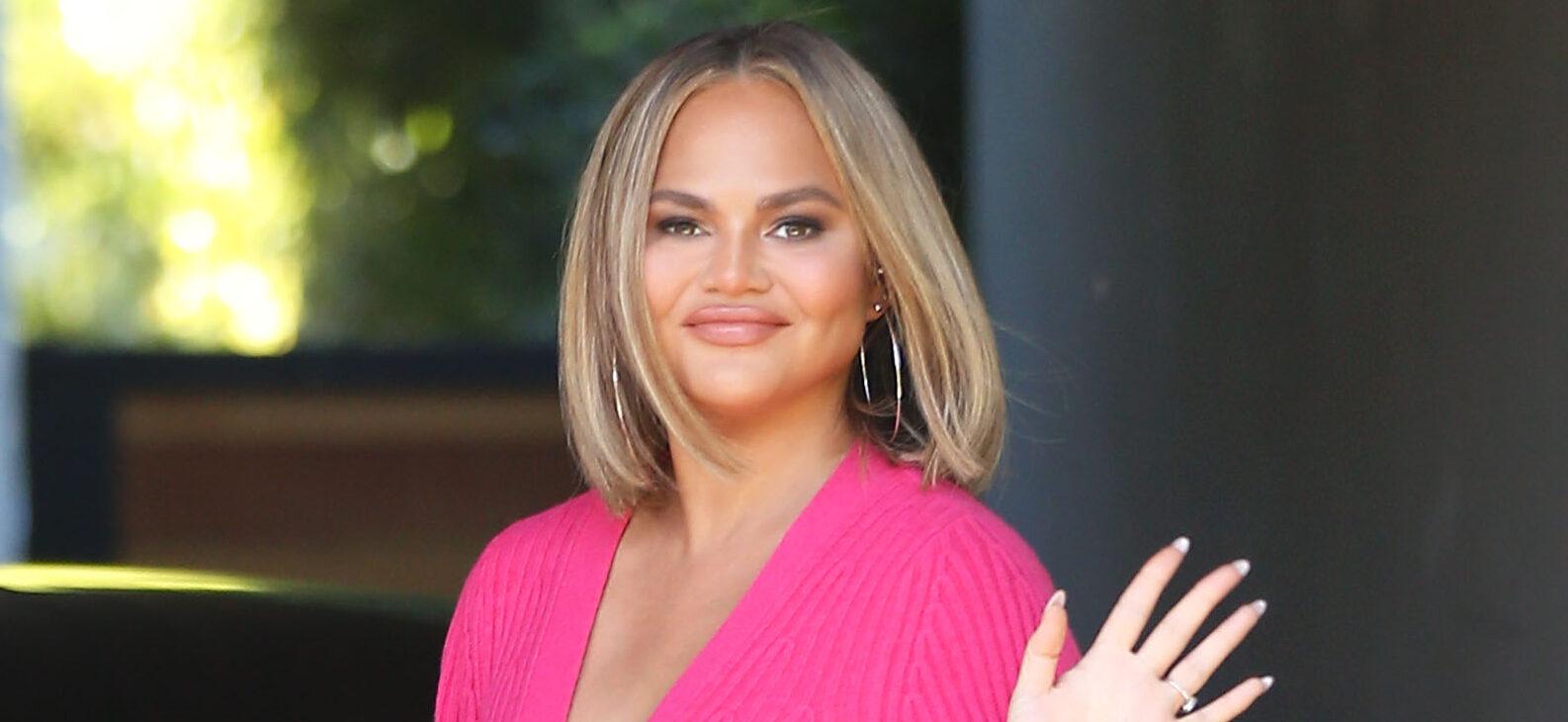 Chrissy Teigen smiling.