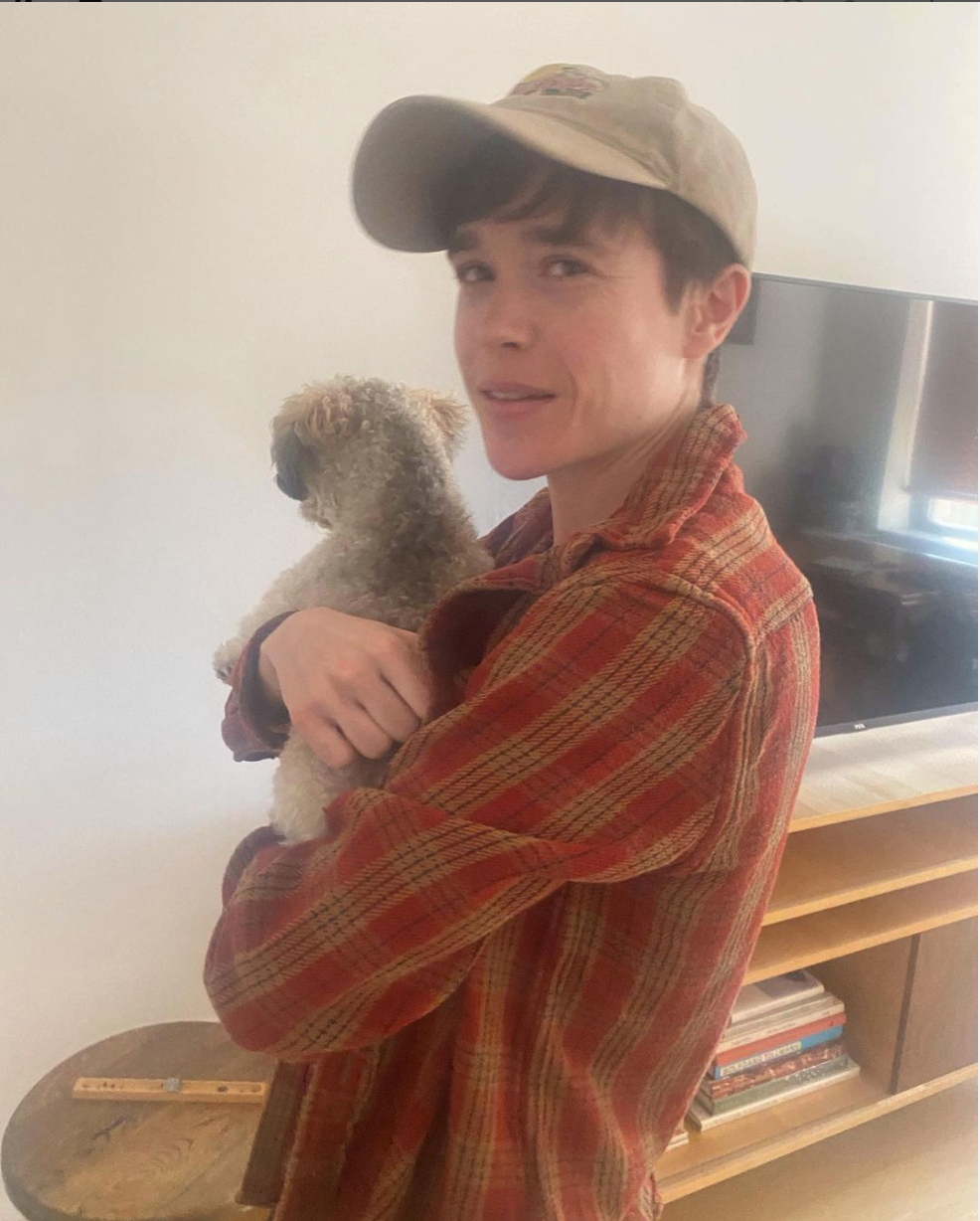 Elliot Page holding a dog
