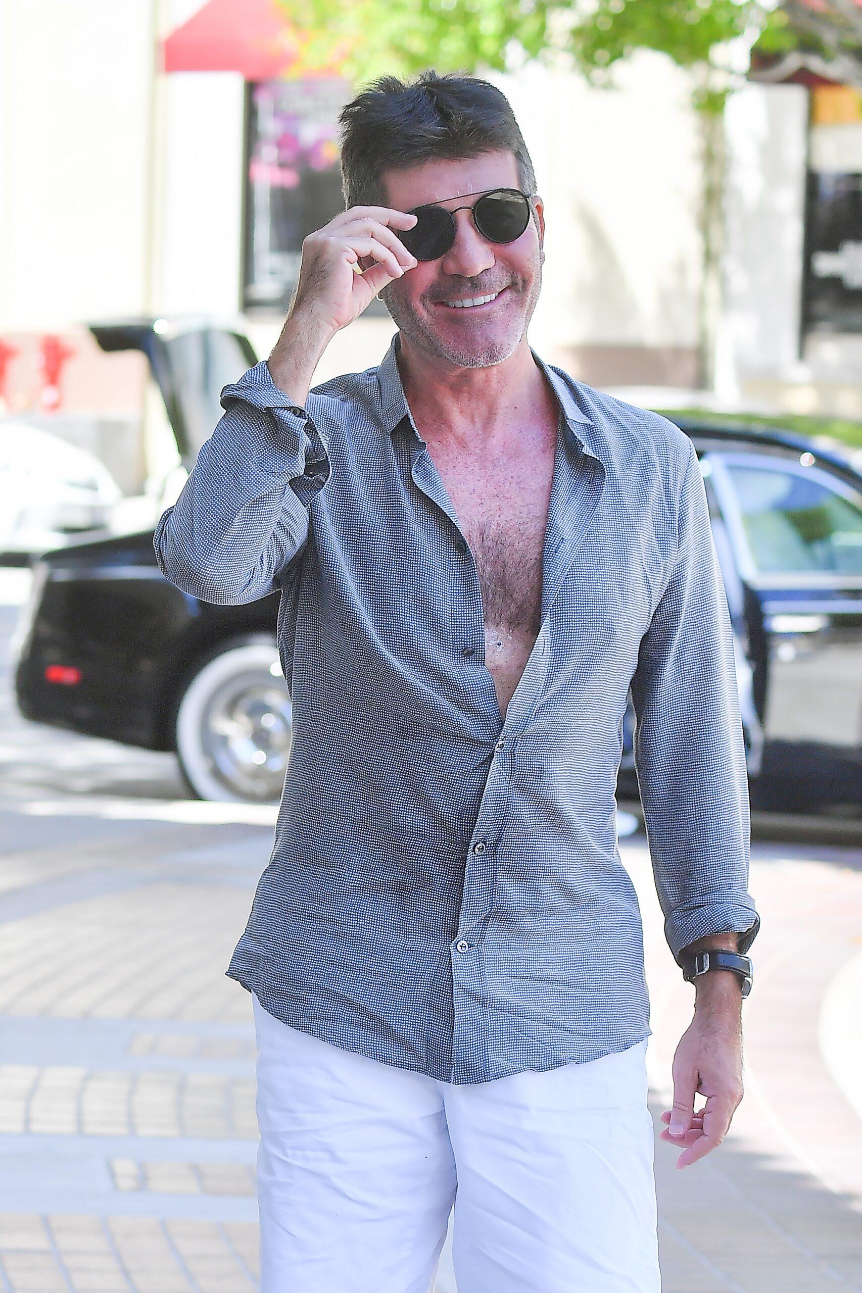Simon Cowell arrives to AGT with an unbuttoned shirt