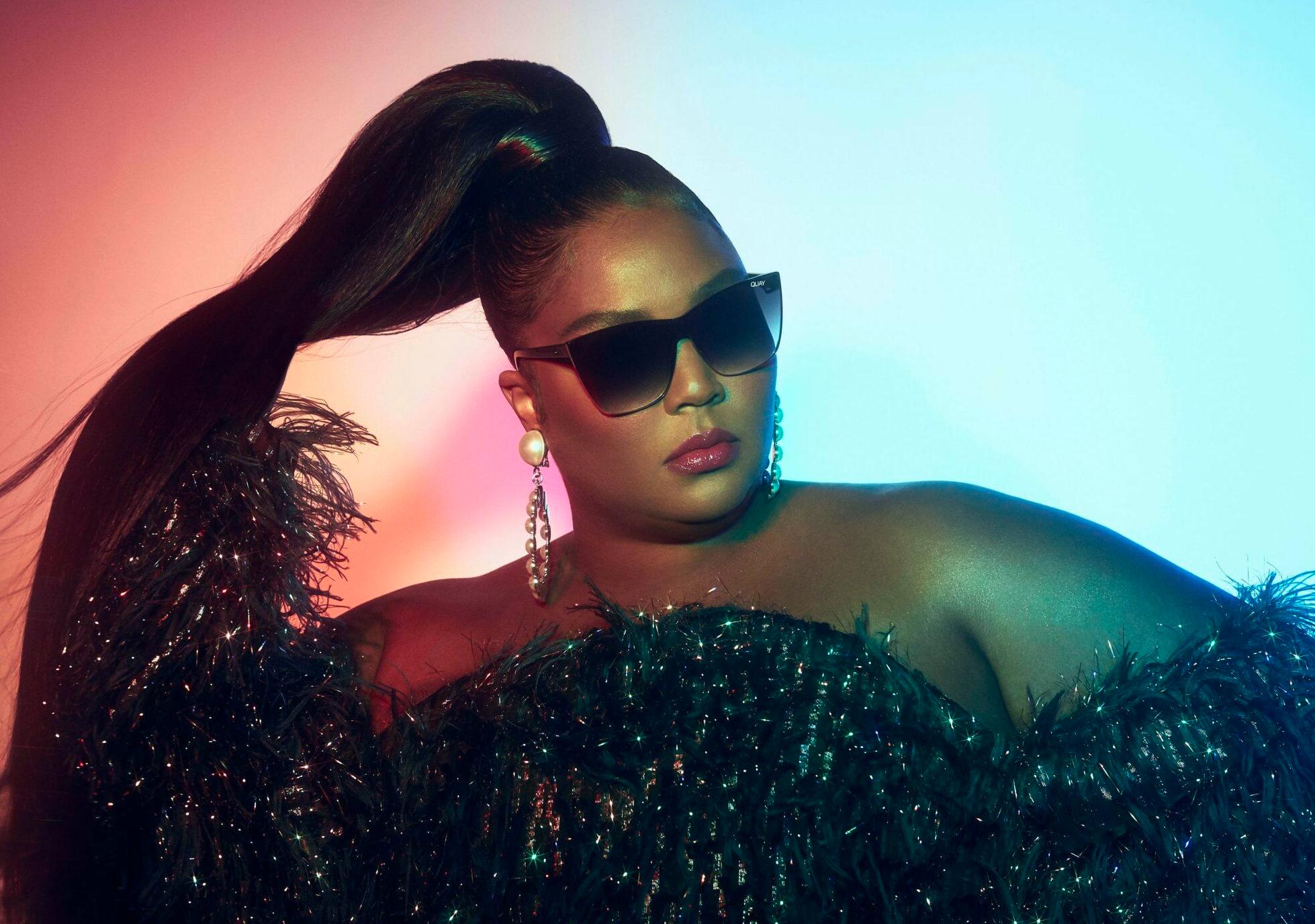Lizzo shows off her 'specs' appeal - as she models a new eyewear collection.