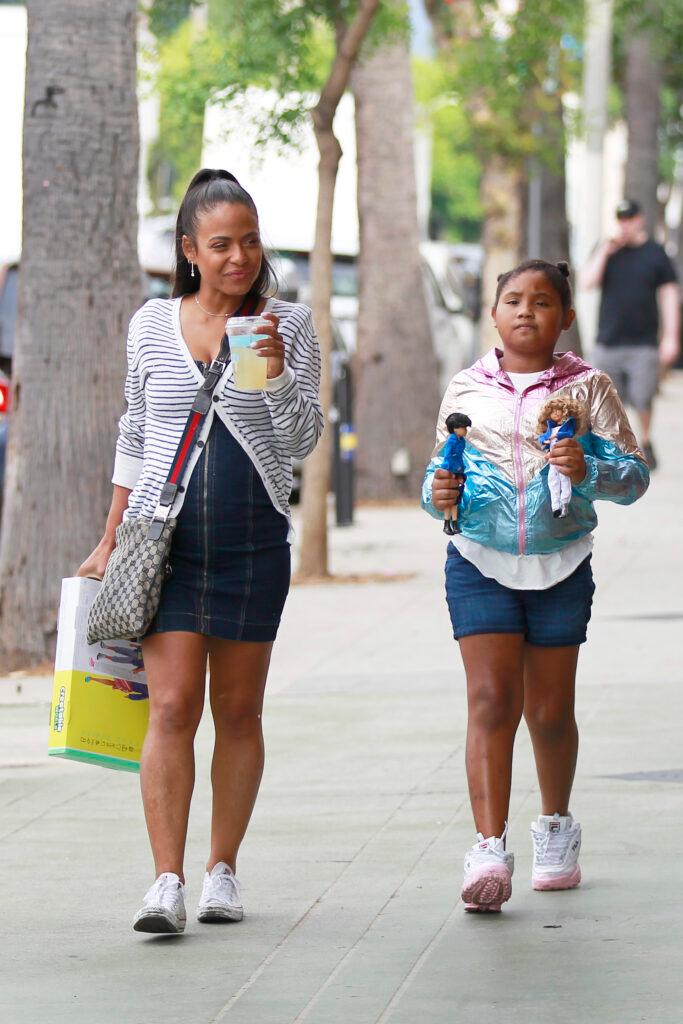 Christina Milian is all smiles and flashes her growing baby bump on her birthday alongside her daughter Violette