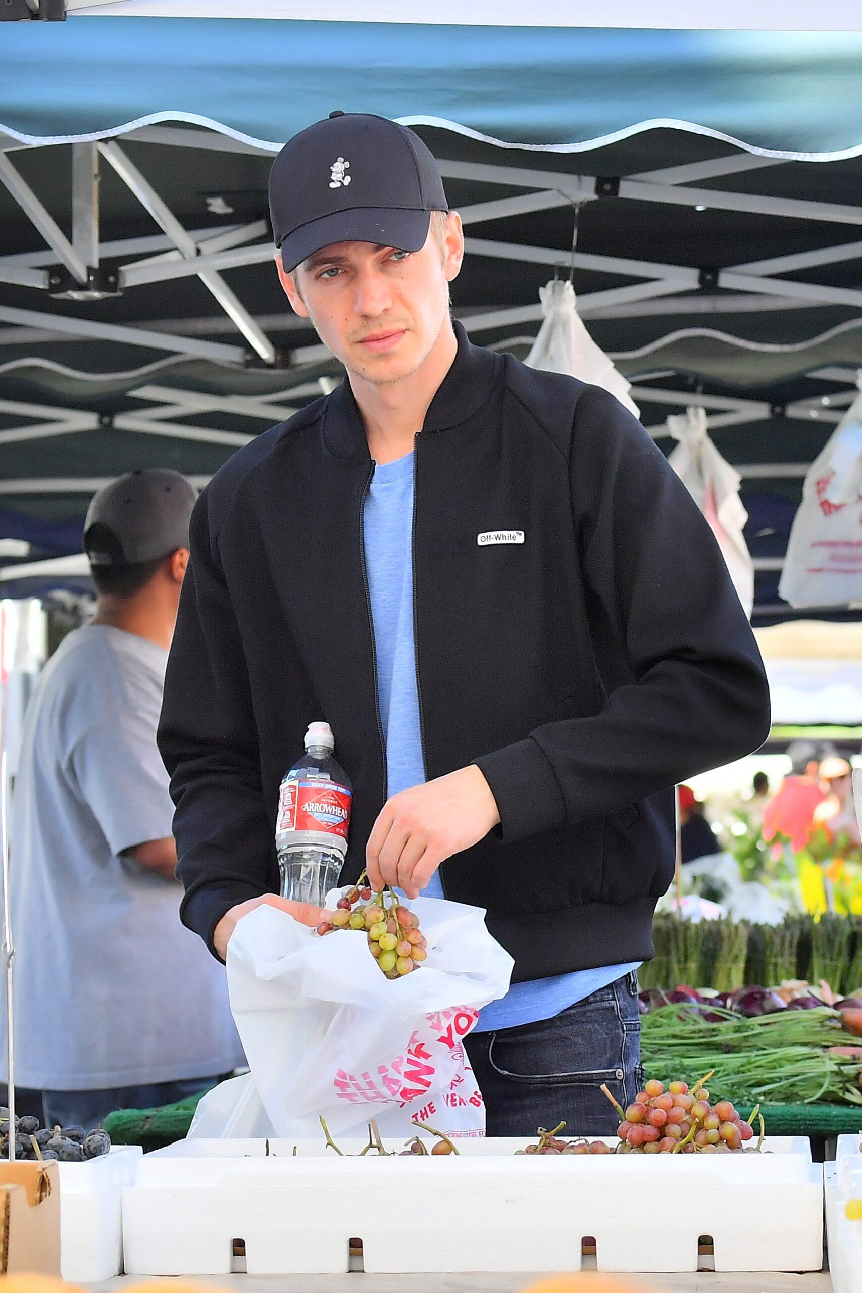 Hayden Christensen samples fruit as he takes his daughter Briar to a farmer apos s market in Studio City