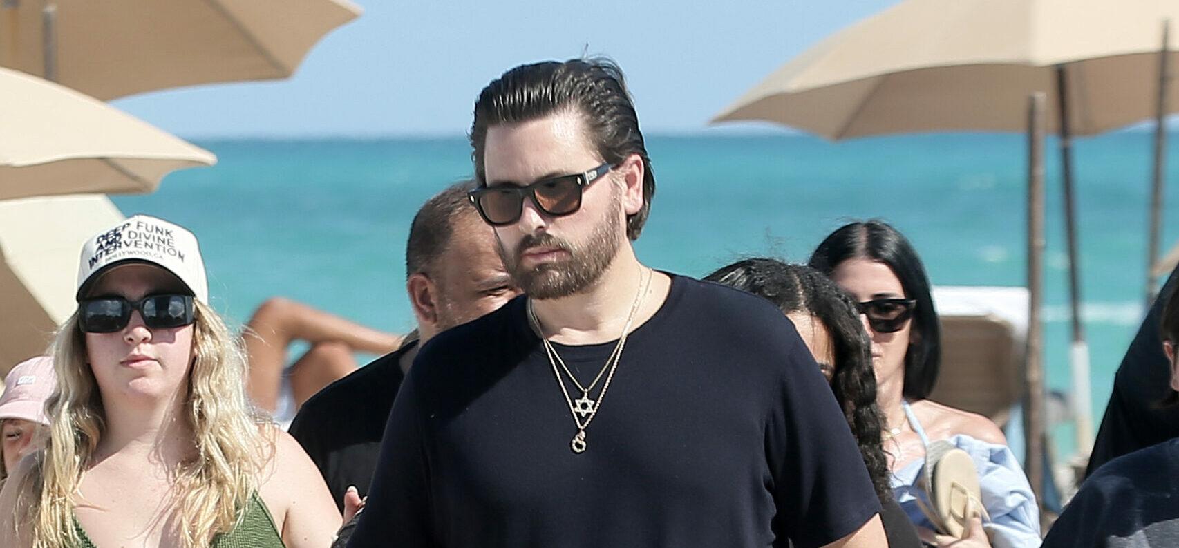 Scott Disick looks relaxed as he spends time with his 3 children on the beach in Miami