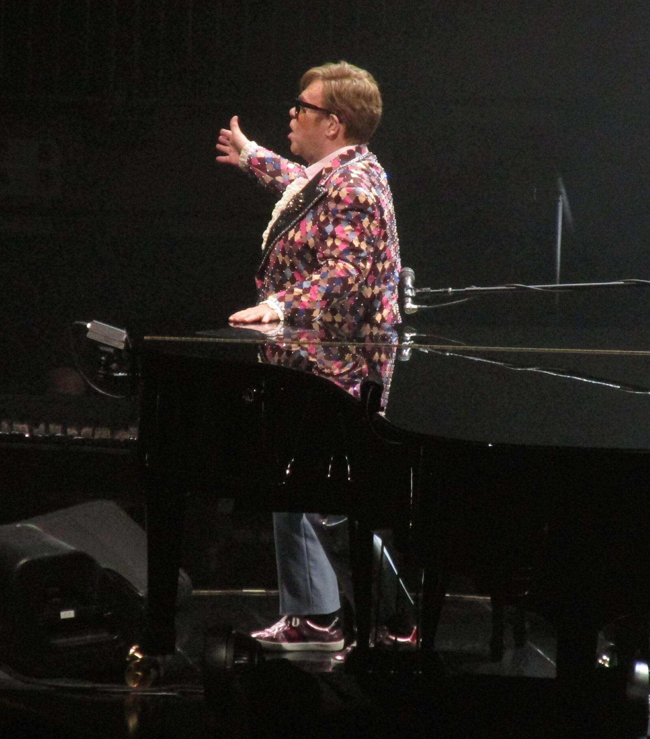 Elton John waves to the crowd as he changes three times during his finals shows in NYC