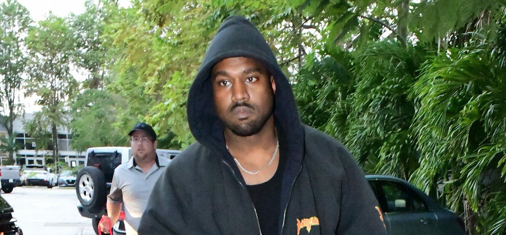 Kanye West is seen for the first time since becoming legally single as he hits up a tattoo shop in Miami